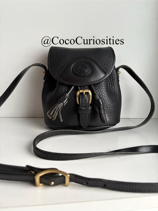 Dooney & Bourke Handbags - Dooney & Bourke awl Black Leather Mini Drawstring Buckle Bag